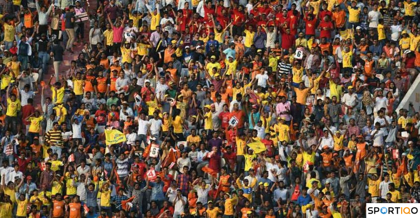 Spectators cheering in an IPL match for their teams 